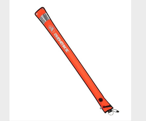 Diver deploying a Delayed Surface Marker Buoy (DSMB) at the surface